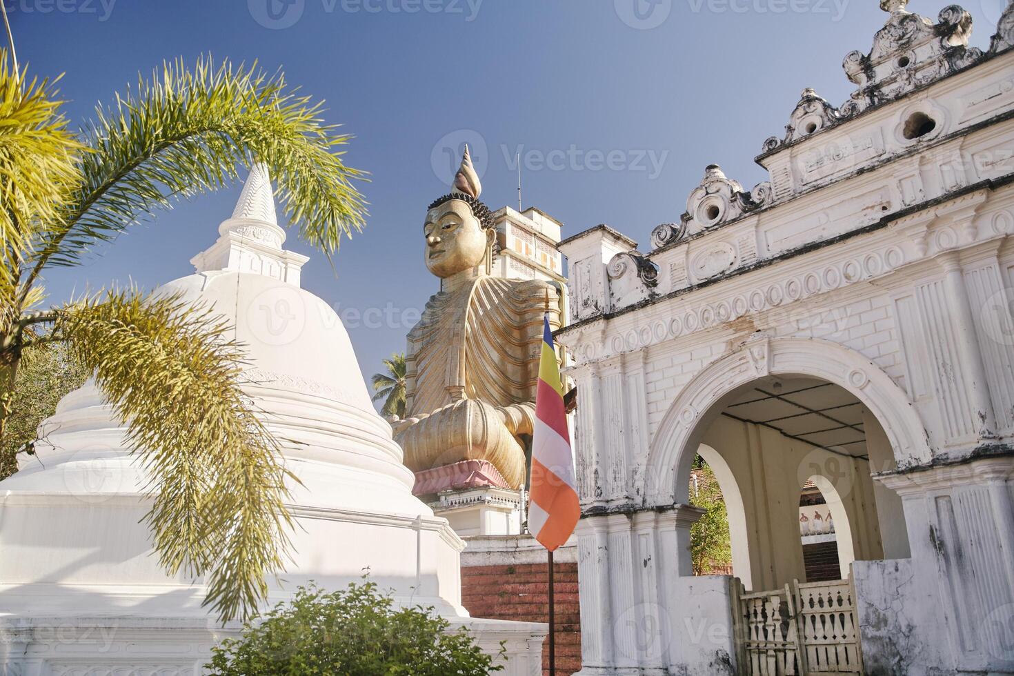 Buddha statue near traditional temple photo