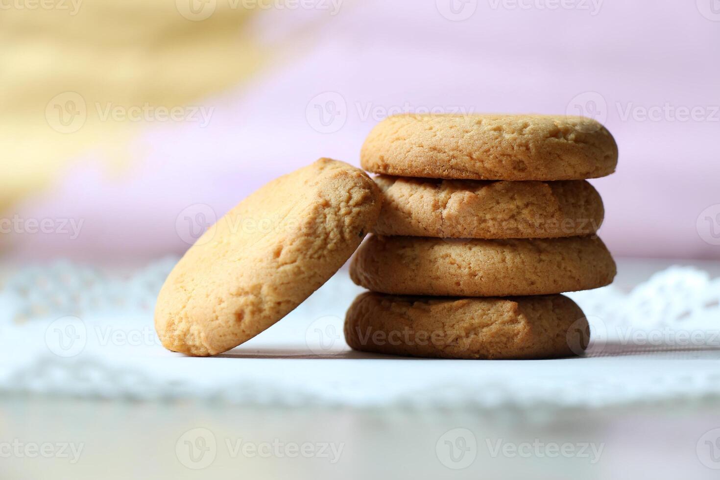 A stack of cookies on a white table photo