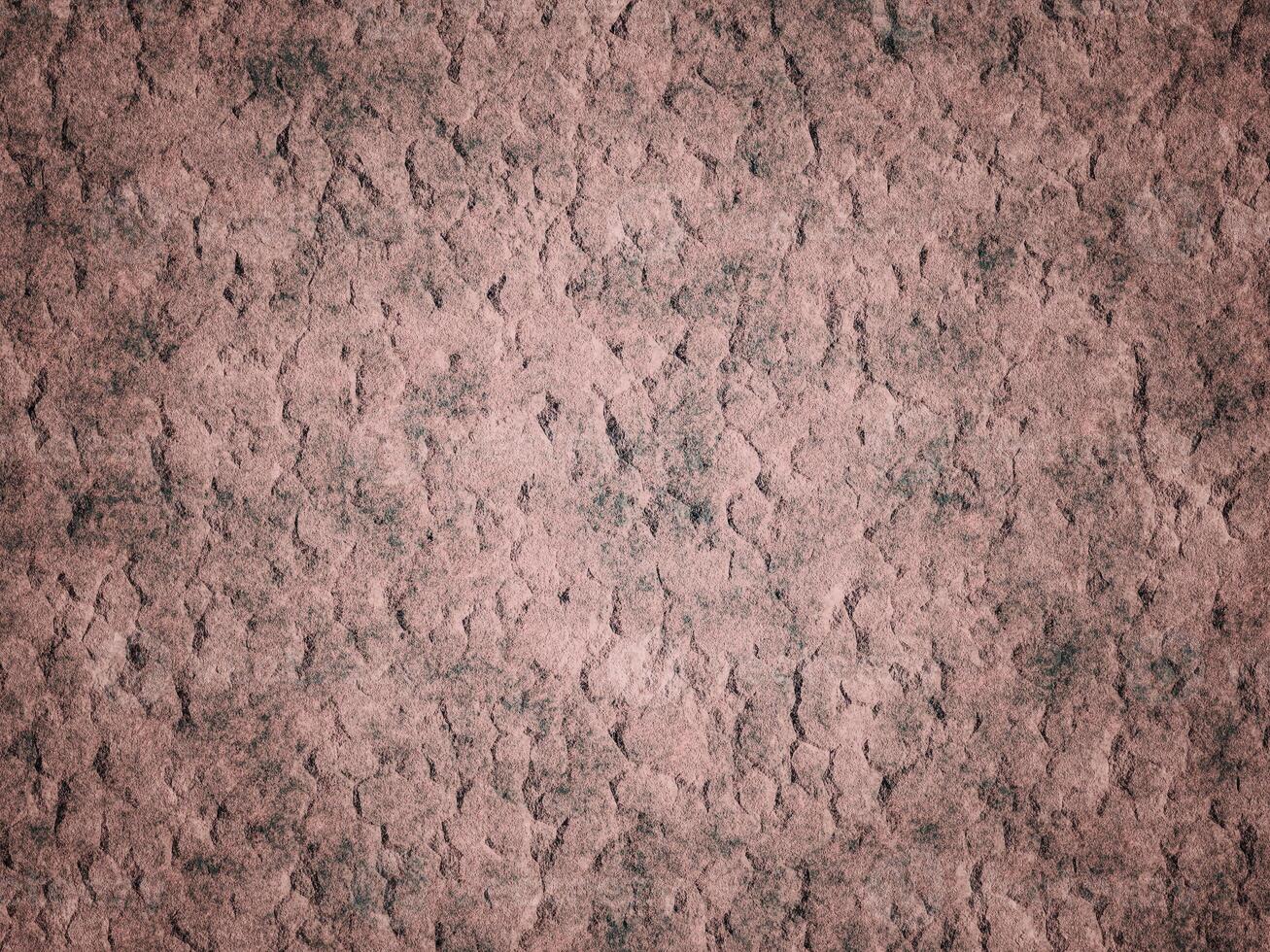 Textured cement wall with cracks, offering a rough and aged appearance. photo