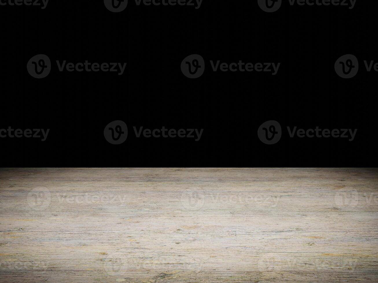 Bright wooden surface with intricate patterns set against an empty black background. photo