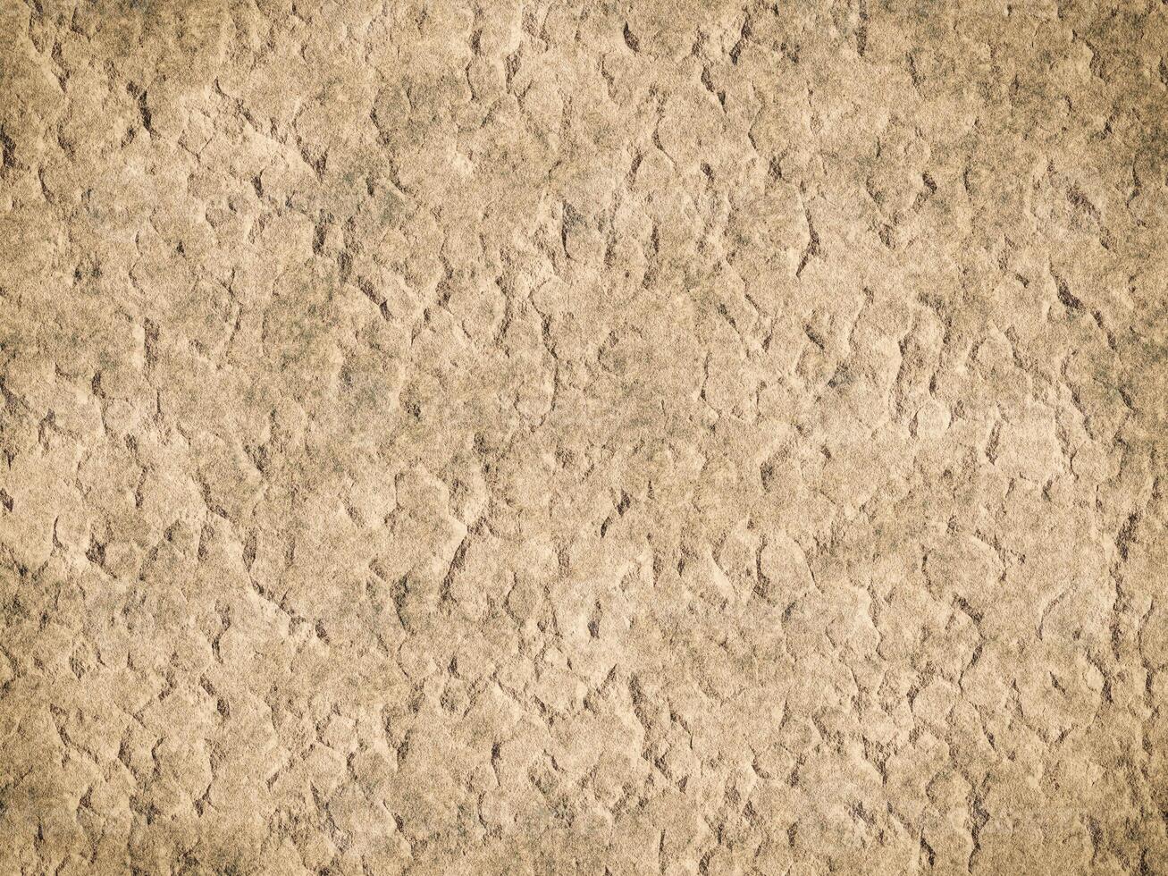 Textured cement background showing rough and cracked appearance. photo