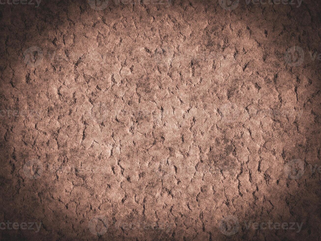 Detailed rough cement surface with visible cracks and unique texture. photo