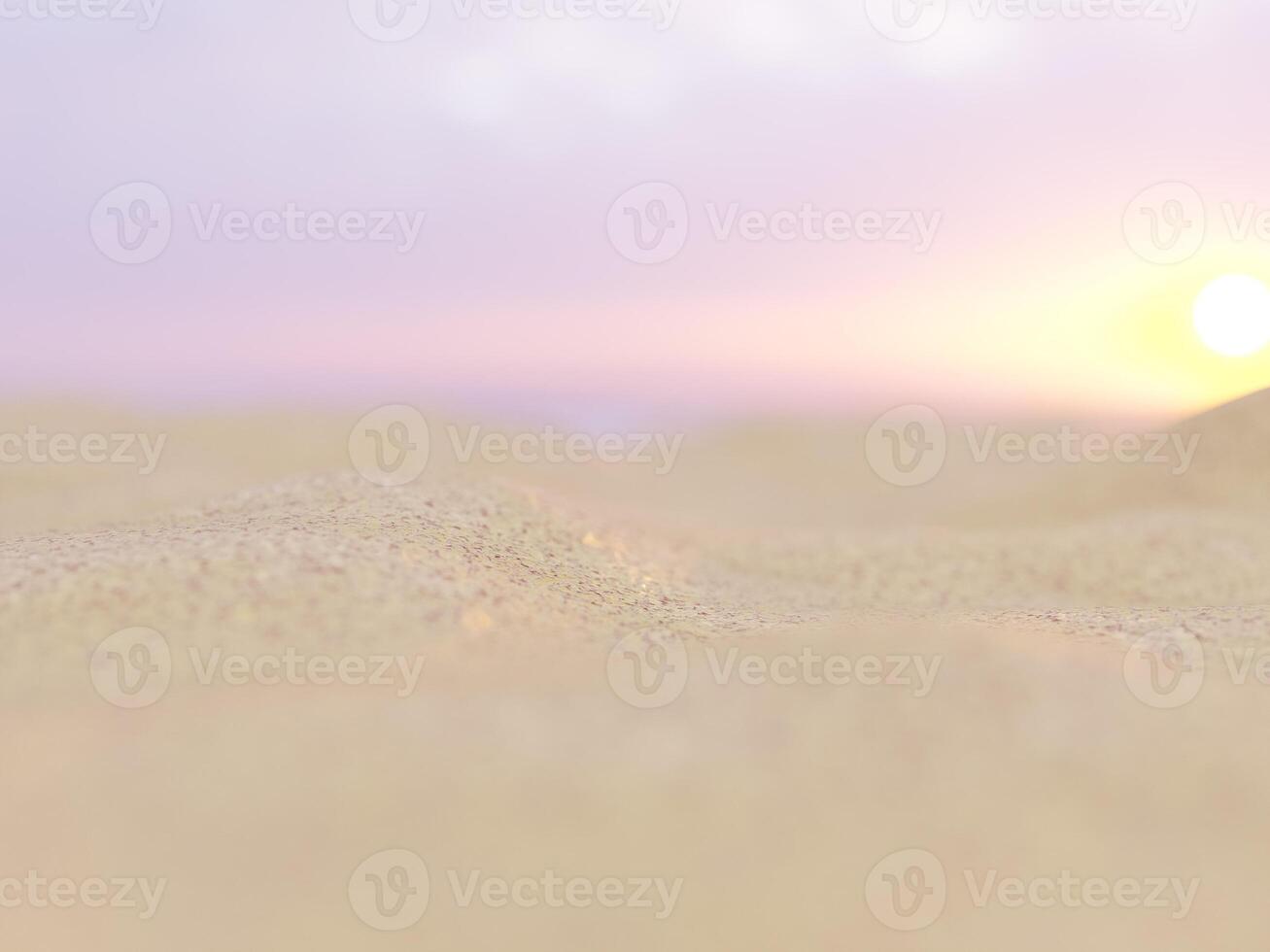 Sandy beach dunes with blurred ocean waves and a clear sky in the background. photo