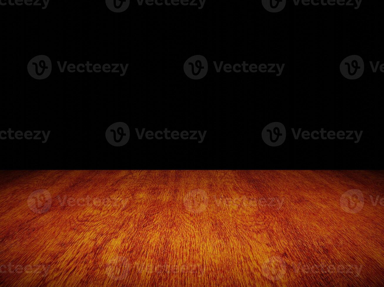 Smooth light wood table with gentle texture, perfectly framed against a black background. photo