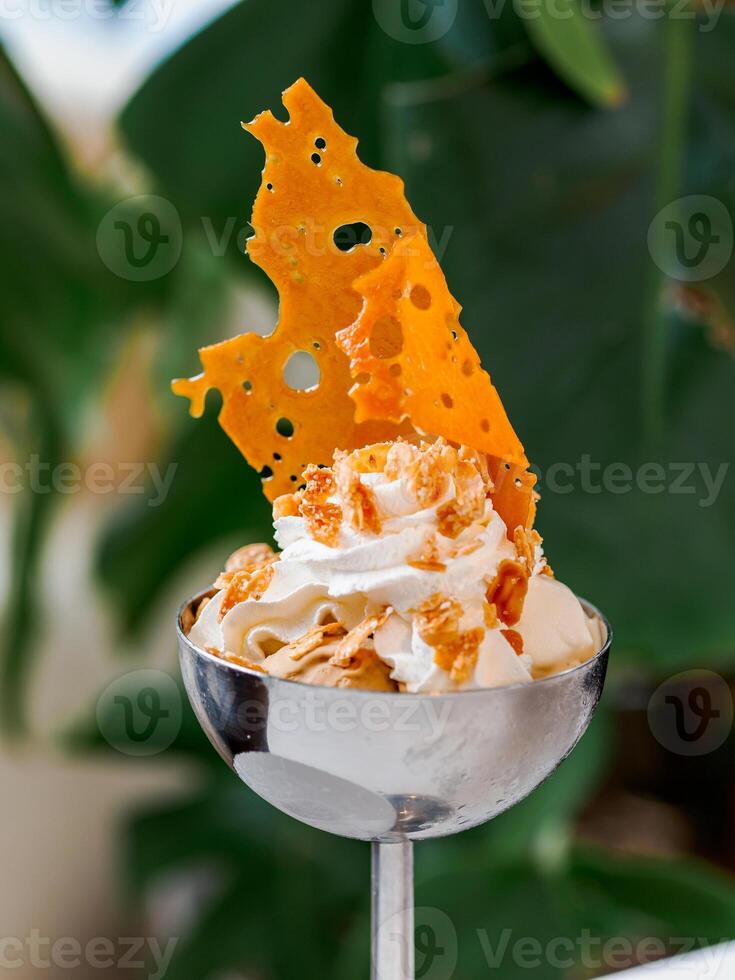 Dessert with caramel and whipped cream photo