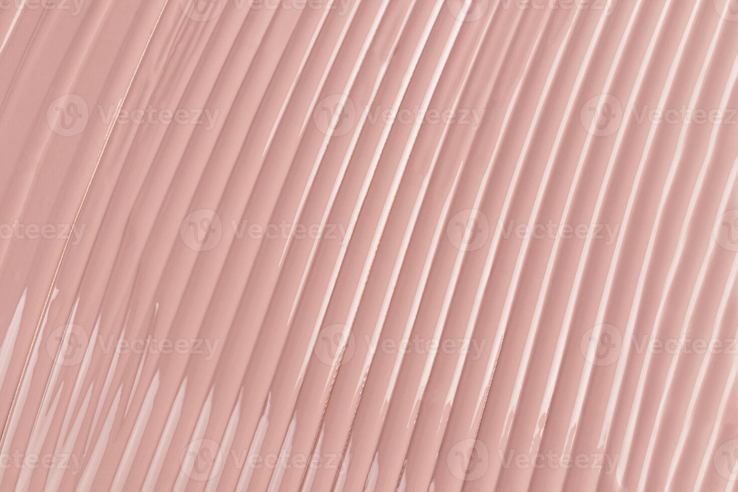 A sample of liquid foundation in a natural tone. delicate parallel stripes of foundation with highlights. natural cosmetic. layout for advertising. photo