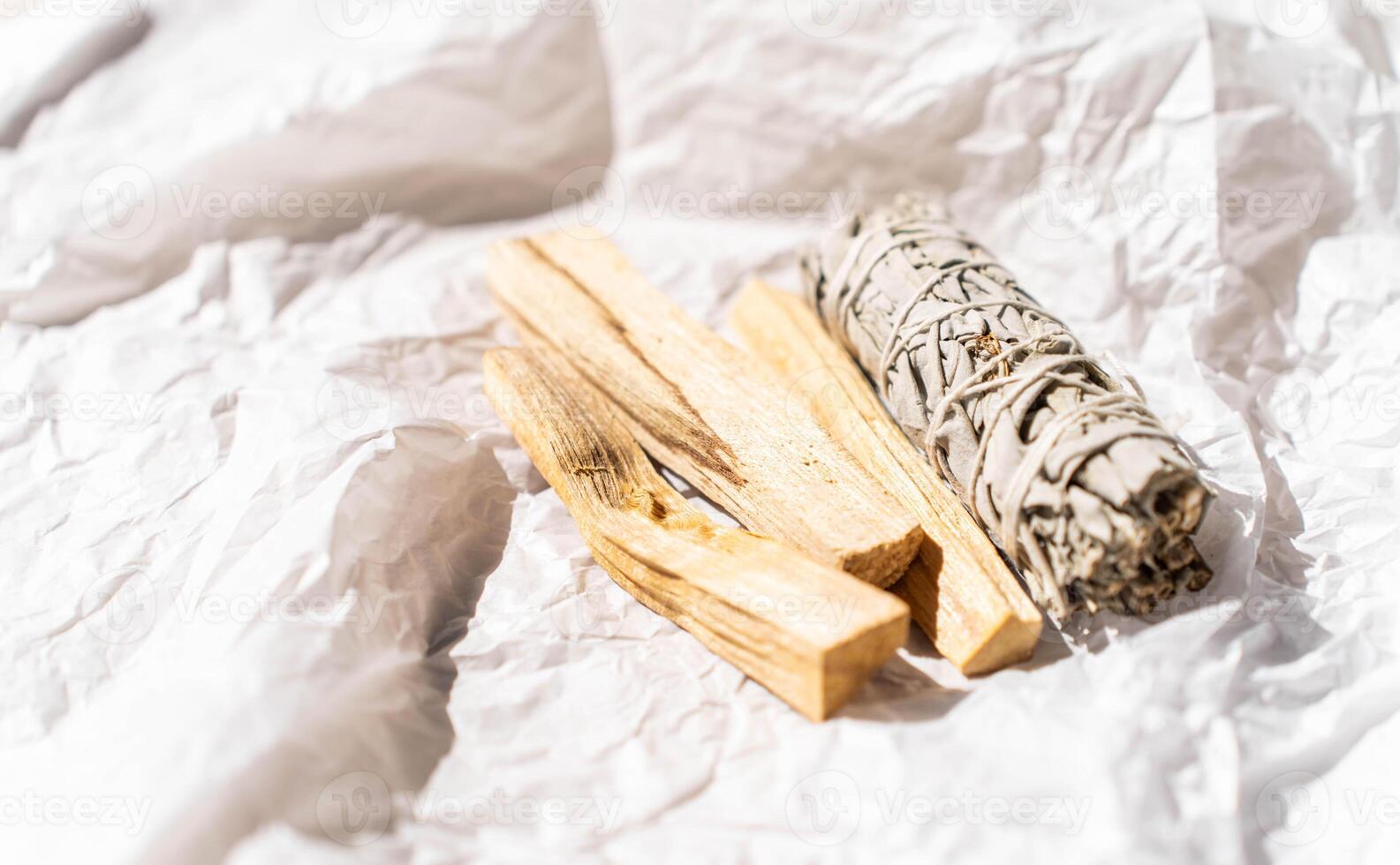 White sage and Palo Santo sticks light paper background. A set of incense for fumigation photo
