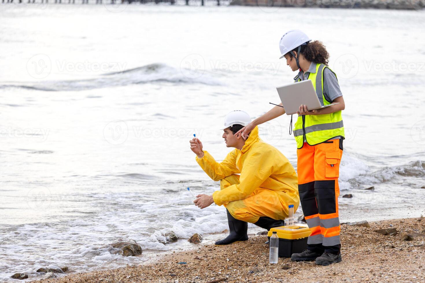 Researchers Testing Water Quality at a Lake or Coastal Area, Environmental Scientists Collecting Water Samples for Analysis, Water Pollution Control, Scientists at Work in the Field photo
