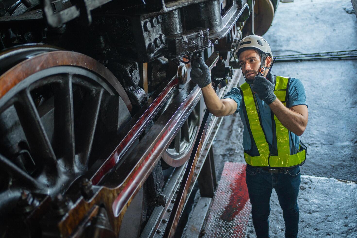 Technician working on steam engine photo