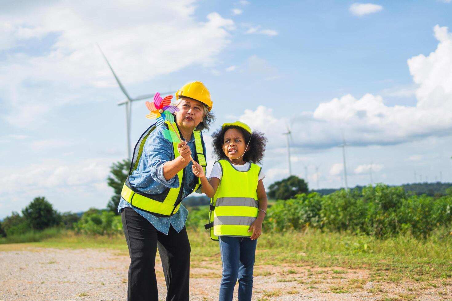 woman is wearing a yellow vest and the child is wearing a yellow vest photo