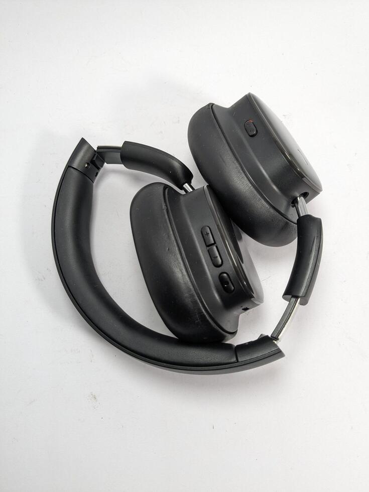 Black Folded Headphones on White Background Showing Details of the Design photo