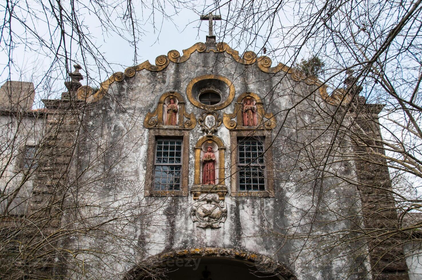 Facade of an abandoned monastery in ruins photo