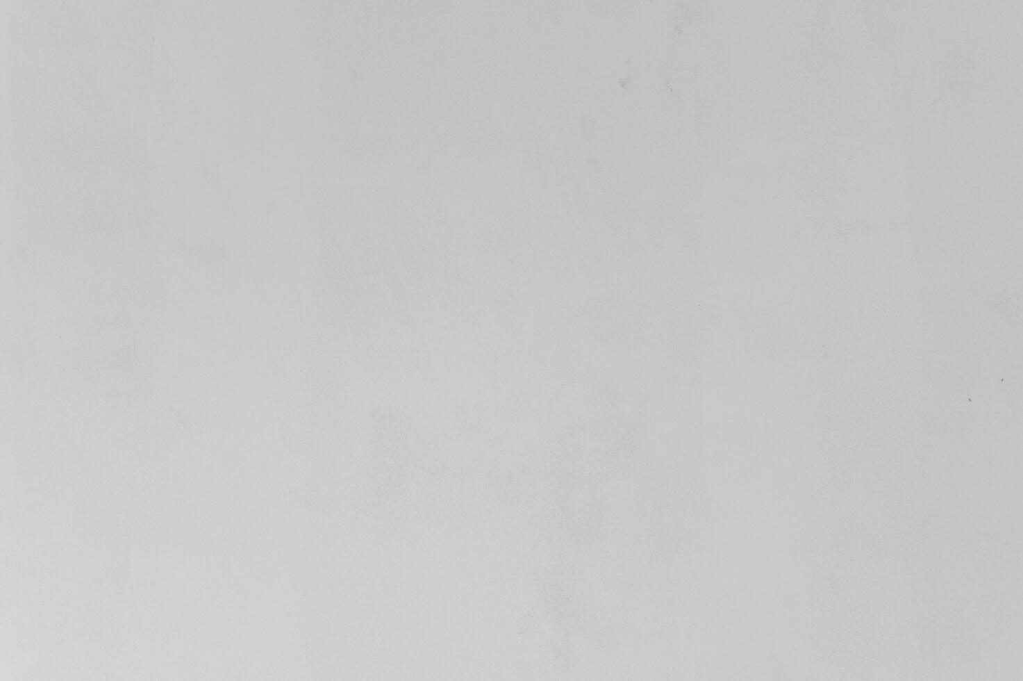 Calm white wall background showing blank surface with subtle texture. simple minimalist canvas for new house renovation project offering clean slate for design ideas photo