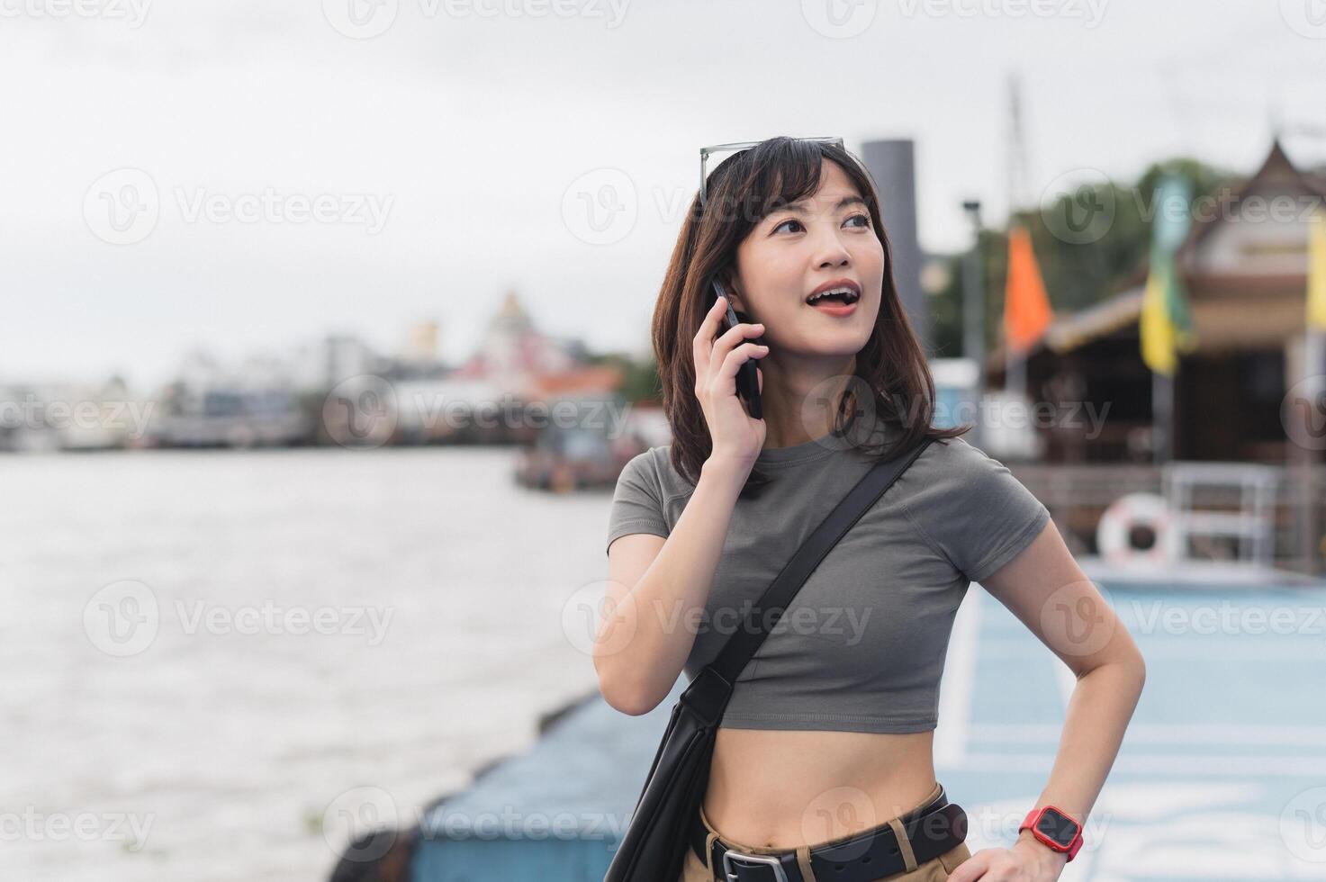 Woman talking on phone by the dock photo