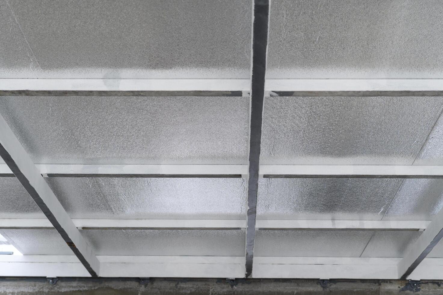 Robust metal beams provide essential structure for ceiling sheet layer, generously insulated underneath with protective pu foam, offering feeling of secure strength and thermal efficiency photo