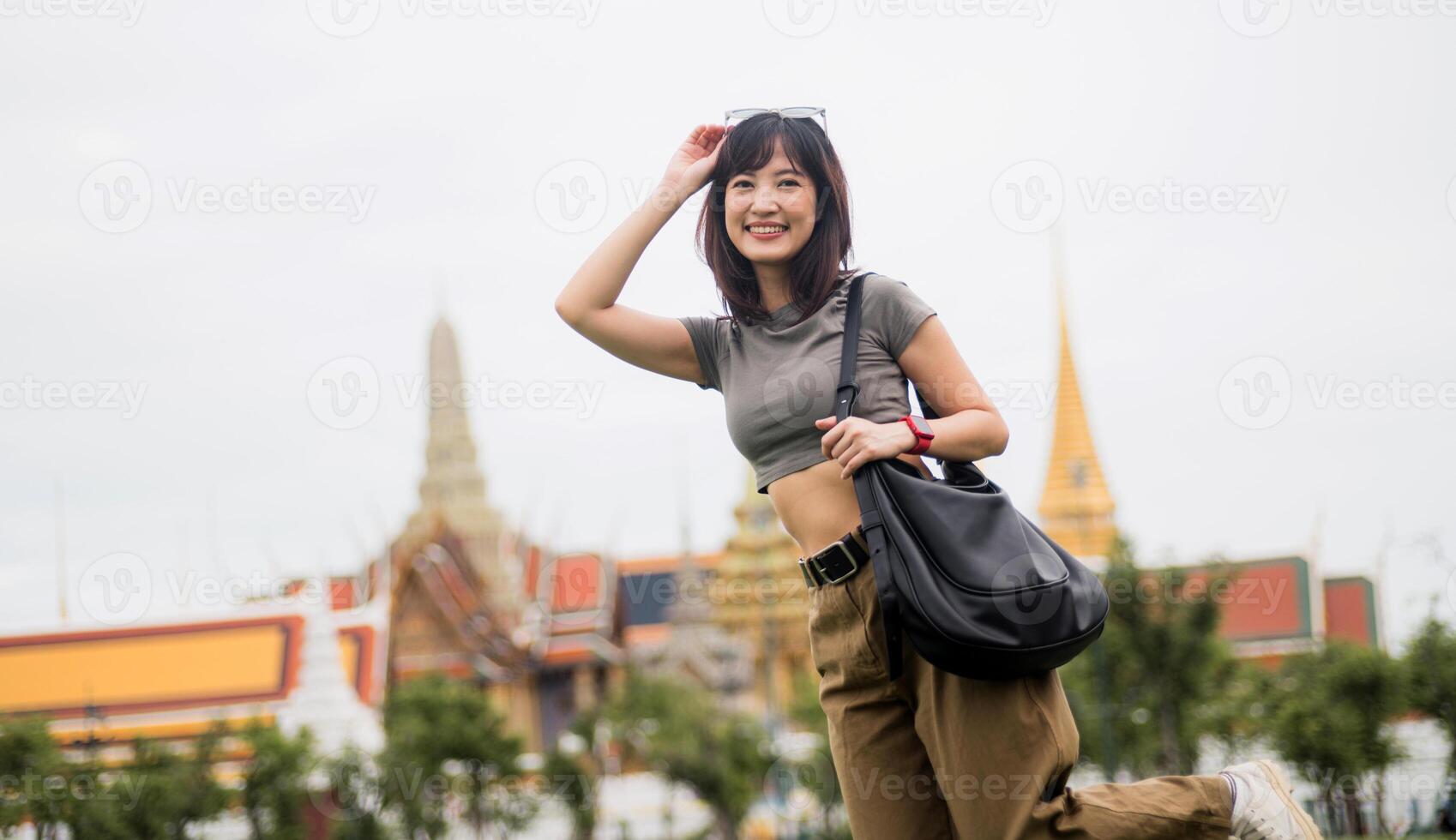 Happy solo southeast asian woman and teenager blogger enjoying world travel tourism concept. local cultural experience for an explorer in Bangkok Asia tourism in Thailand photo