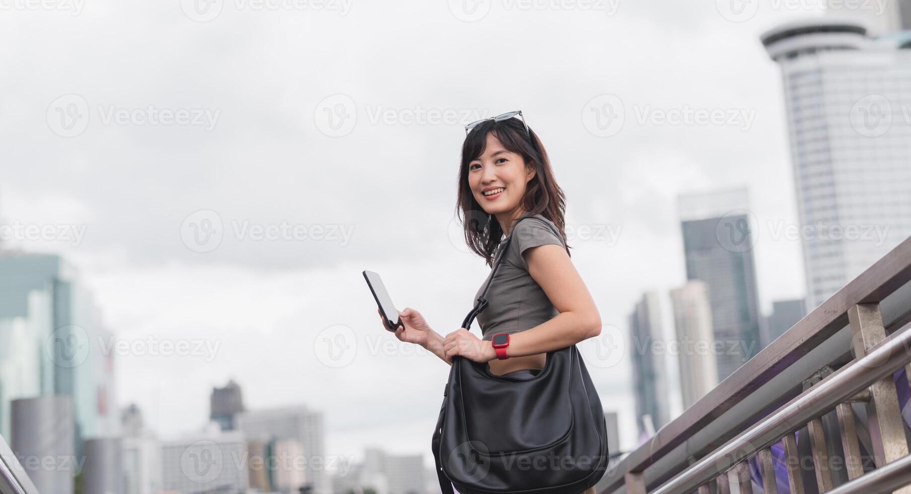 Happy young southeast asian woman teenager blogger using smartphone for searching travel guide. World explorer with local cultural experience on Chao Phraya river in Bangkok Asia tourism concept photo