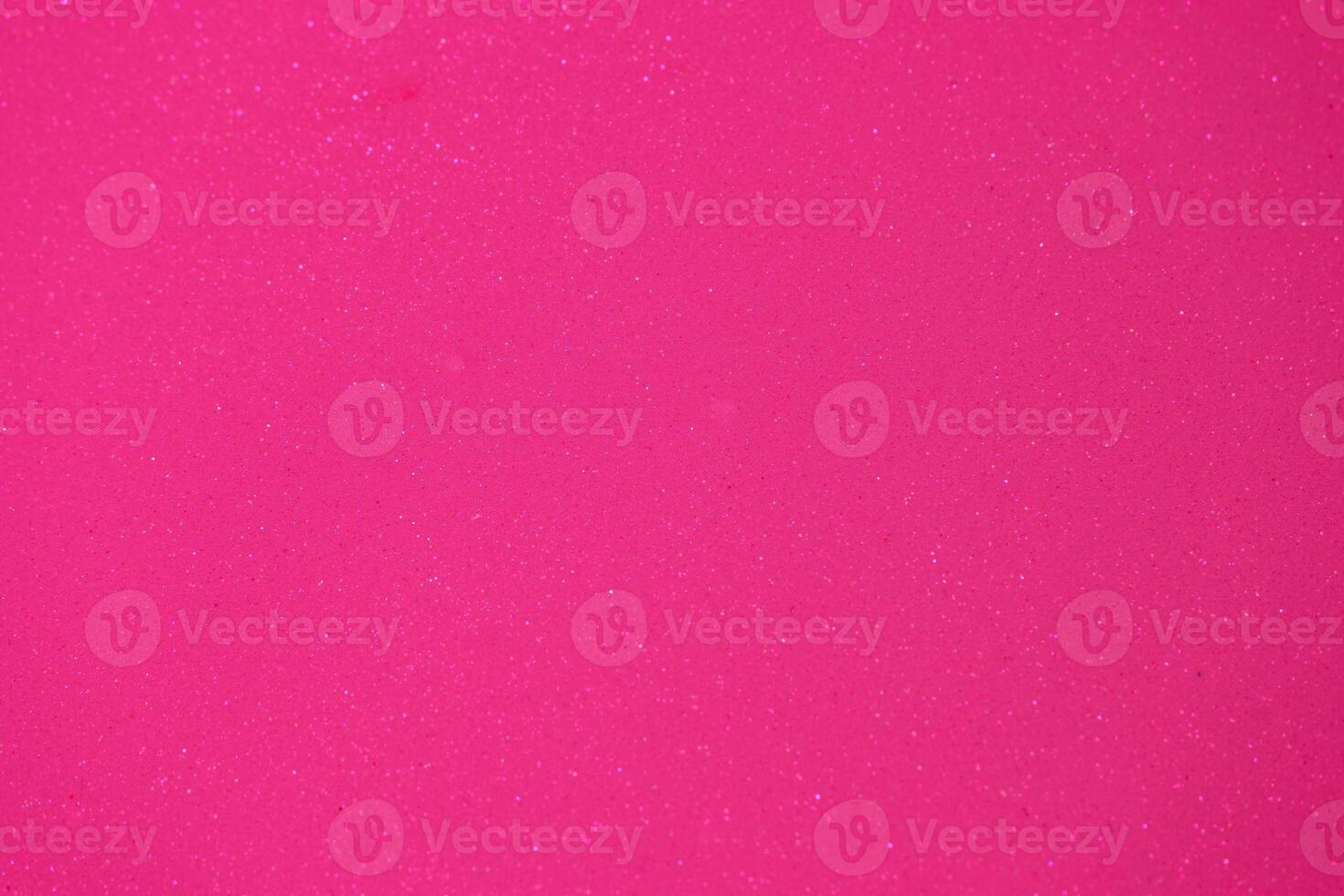 Bright pink sparkly surface ideal for creative arts and crafts projects during daytime activities photo