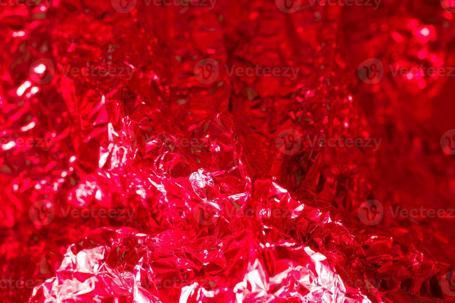 Vibrant red metallic foil texture creating a striking visual detail in an artistic display photo