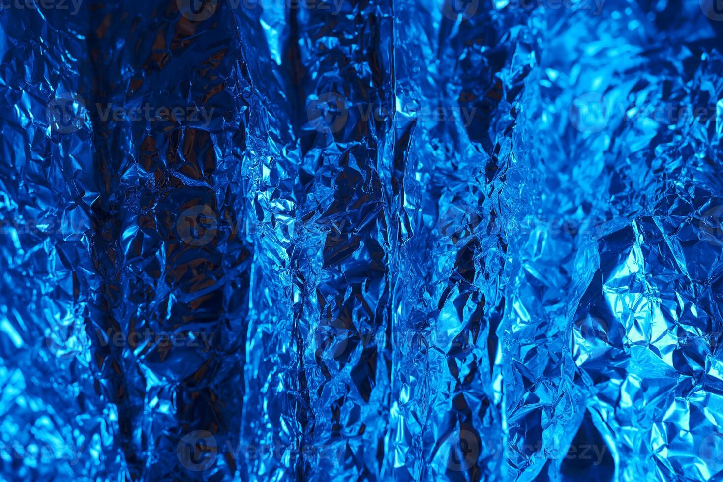 Bright blue metallic foil creating an abstract texture in a vibrant composition photo