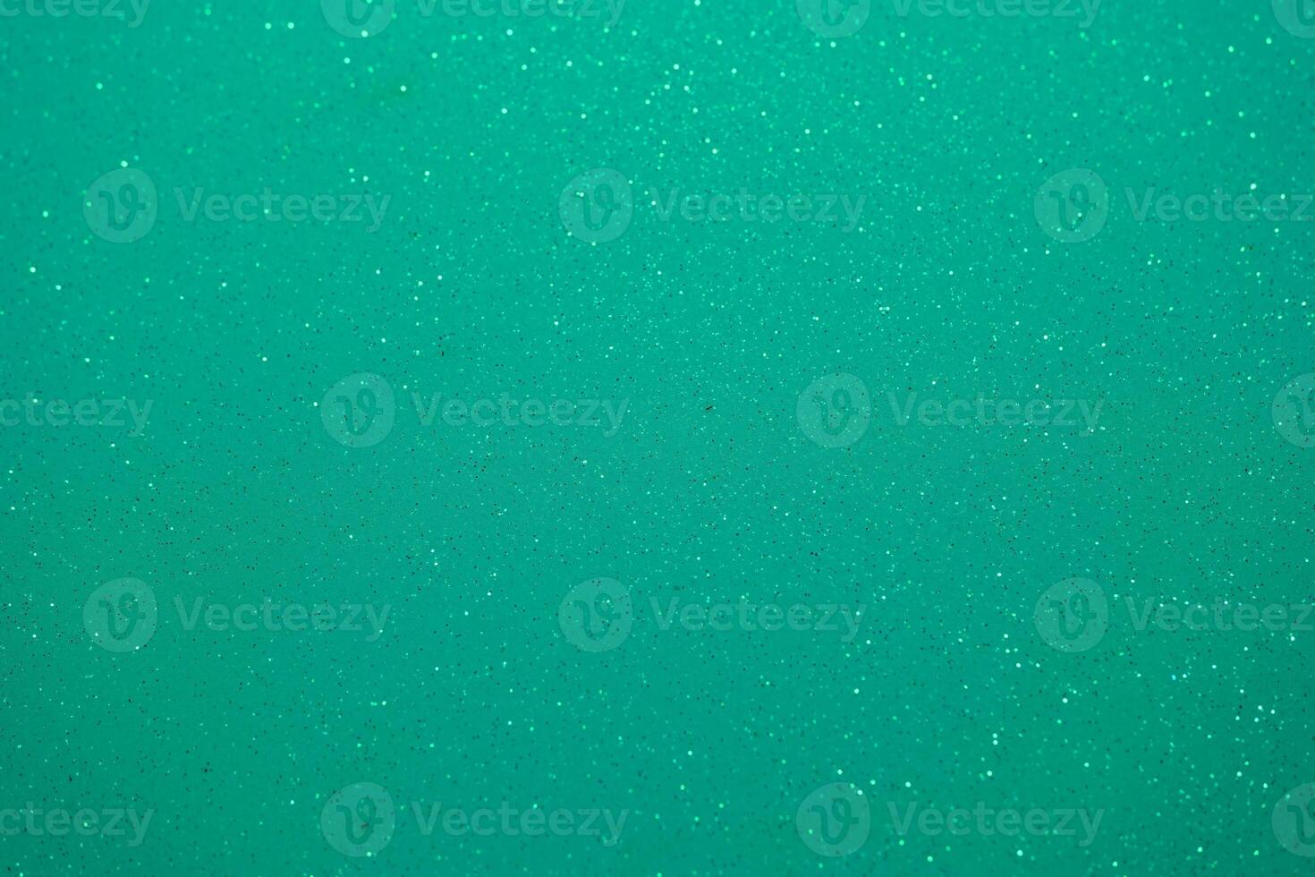 Emerald green background with sparkling texture and subtle shine enhancing the visual appeal of any creative project photo