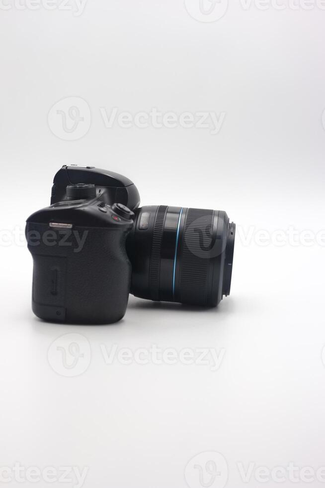 Compact digital camera with lens positioned on a white background showcasing design details and features for photography enthusiasts photo