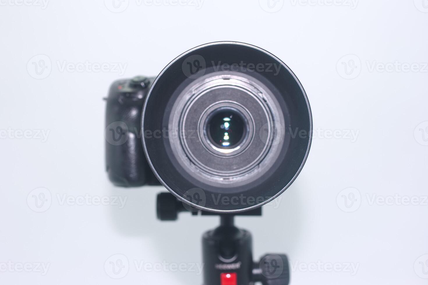 Camera lens ready for a dynamic photography session indoors while capturing unique perspectives on various subjects photo