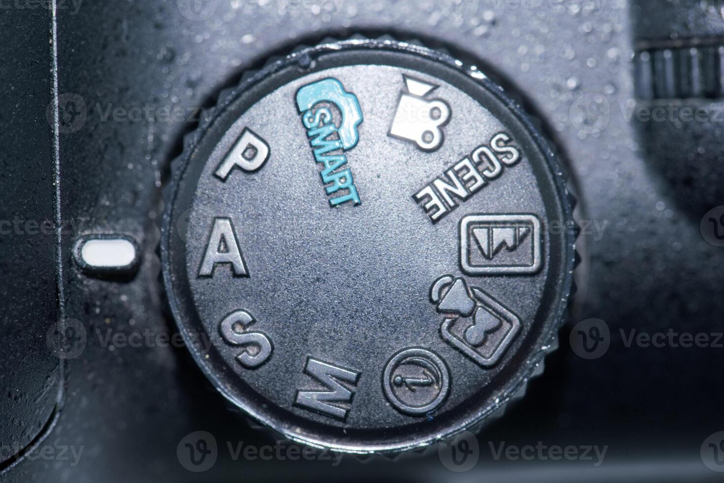 Camera mode dial showing various settings for photography and videography techniques photo