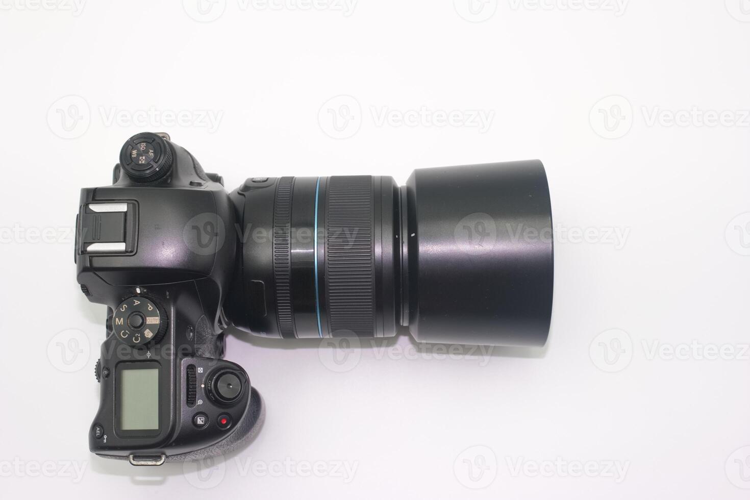 Digital camera with large lens displayed on a white background showcasing photography equipment details photo