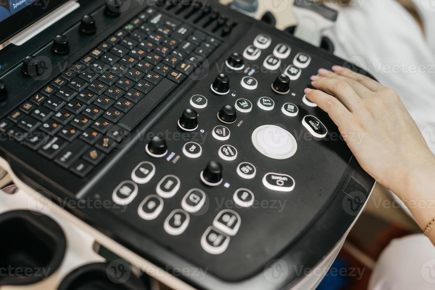 Concept medical imaging. Close-up of ultrasound machine as medical worker performs scan. photo