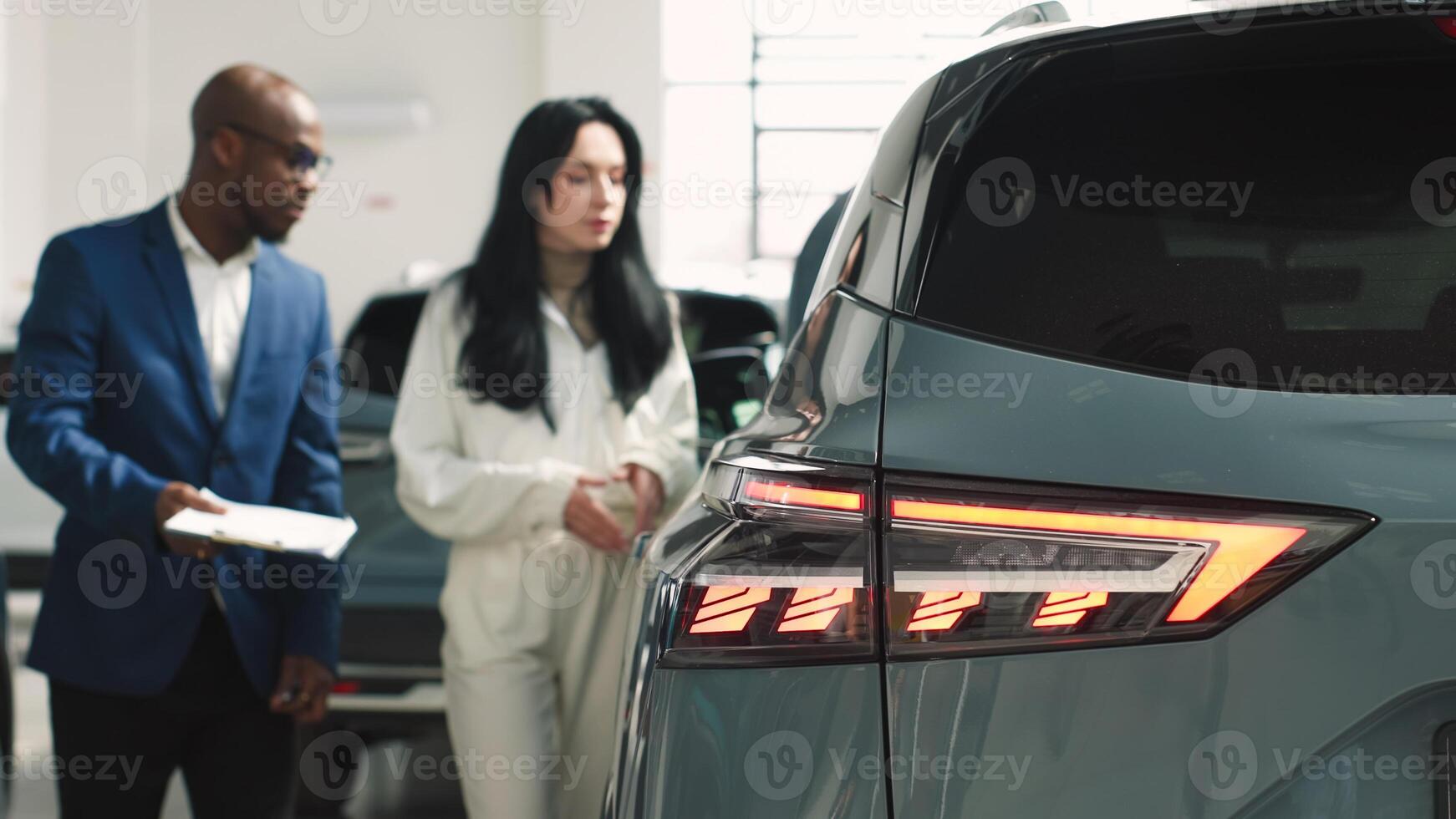 Consultation with the seller when buying or renting a new car. The concept of buying or renting a new car from a car dealership photo