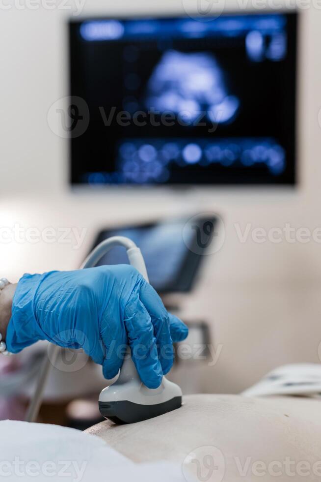 Ultrasound of a pregnant woman in a clinic. photo