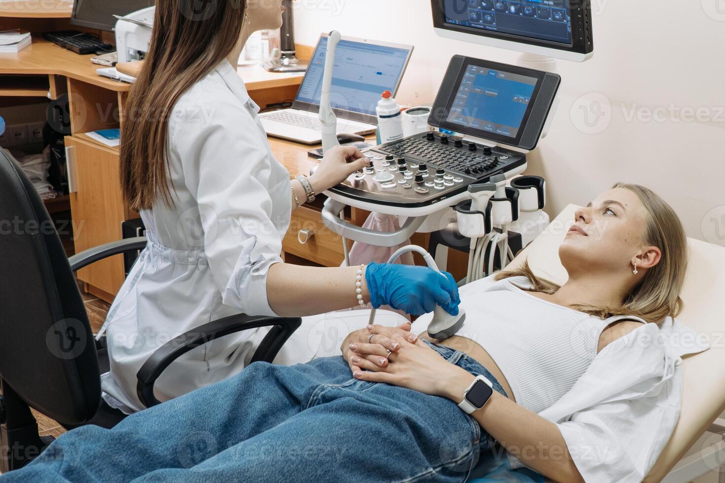 Ultrasound examination in a medical clinic. The concept of pregnancy diagnostics. photo