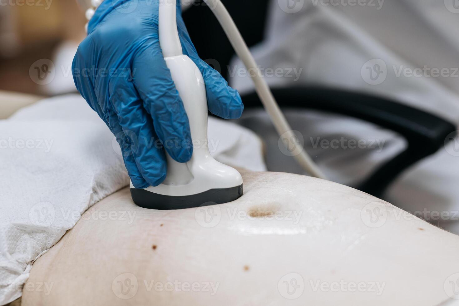 Ultrasound examination in a medical clinic. The concept of pregnancy diagnostics and maternal health protection photo