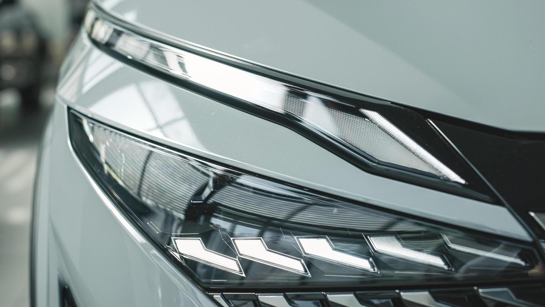 Close-up of car headlights. An advanced design concept that improves visibility, demonstrates innovation and adds style to night driving. photo