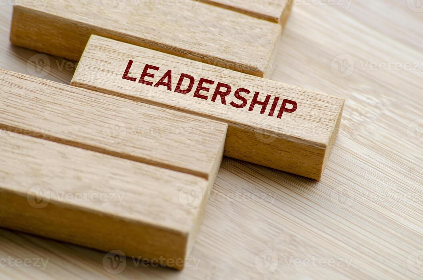 Leadership words arranged on wooden blocks, reminding us of the principles and practices that define a great leader in any professional setting photo