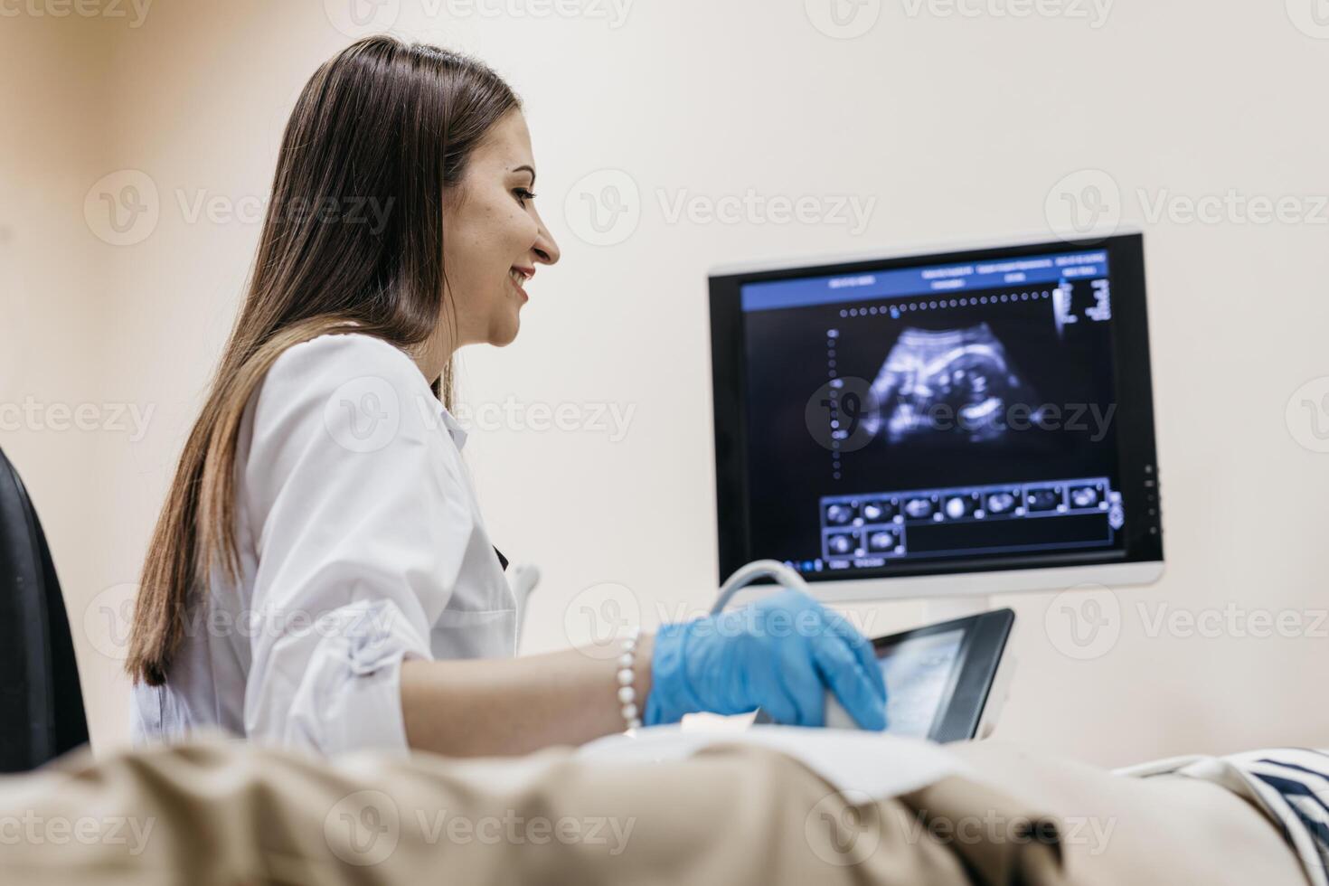 Ultrasound examination in a medical clinic. The concept of pregnancy diagnostics and maternal health protection. photo