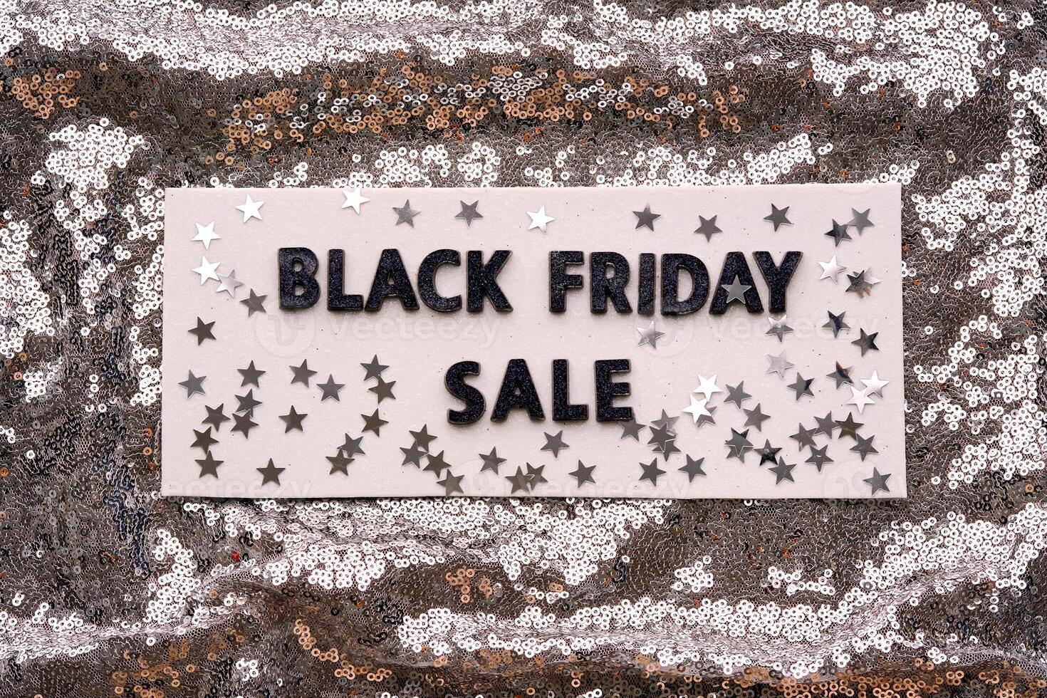 Abstract background of silver sequins with the inscription BLACK FRIDAY SALE. photo