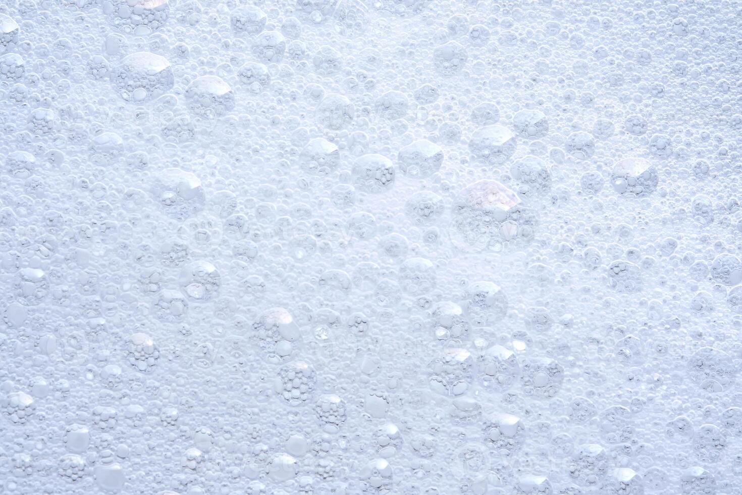 Thick soap foam with bubbles. photo