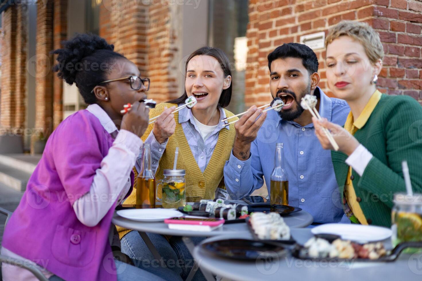 Group enjoying sushi at a table photo