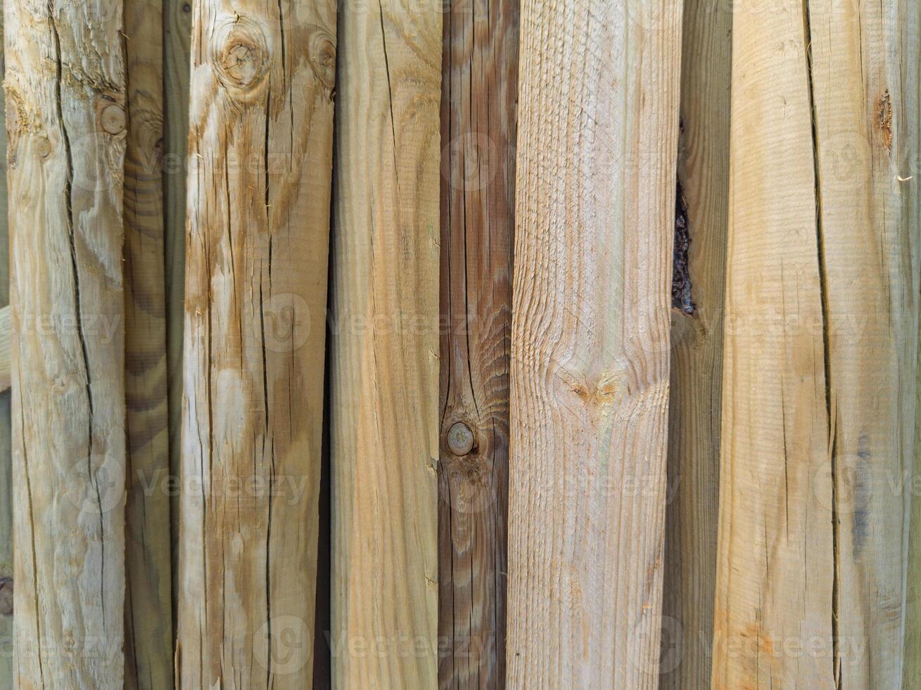 Vertical natural wooden poles background photo