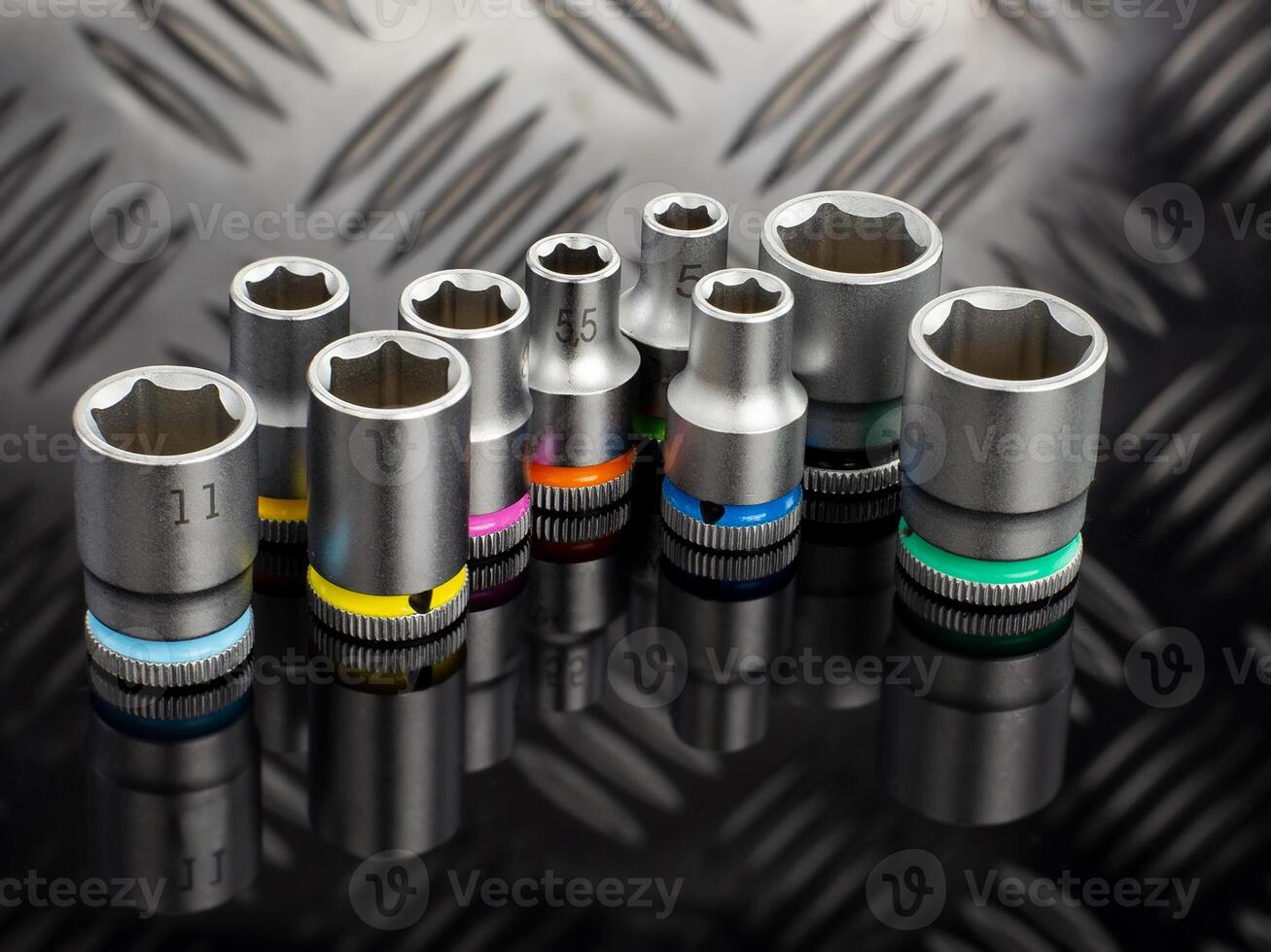 Set of Color Coded Socket Wrenches on Black Surface photo