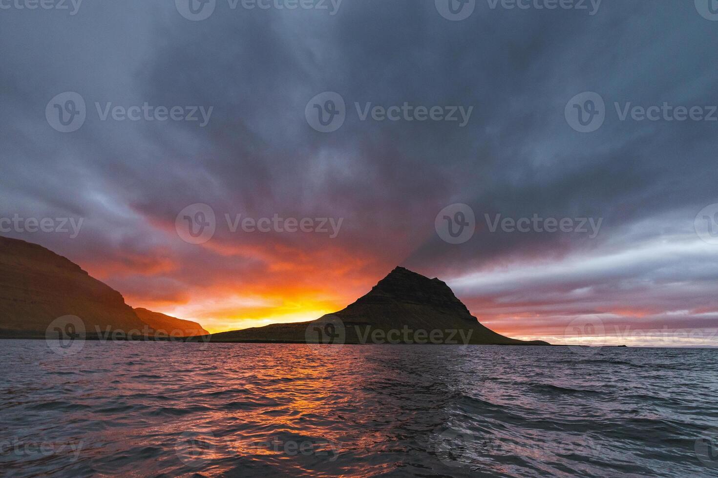 Icelandic sunset over Kirkjufell Mountain photo