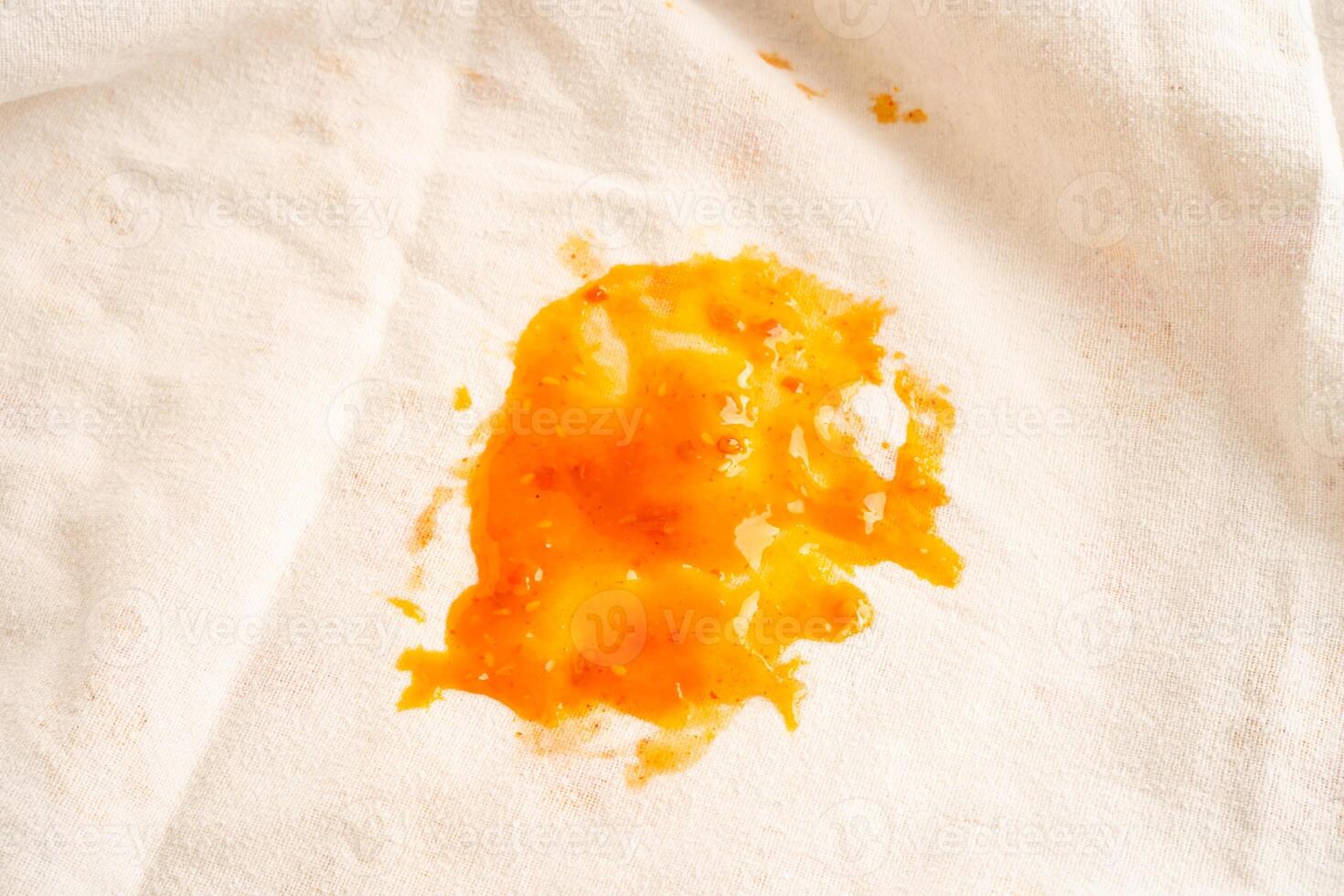 Dirty tomato sauce stain or ketchup on cloth to wash with washing powder, cleaning photo