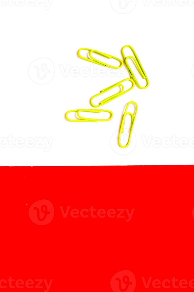Paper Clips on White and Red Background photo
