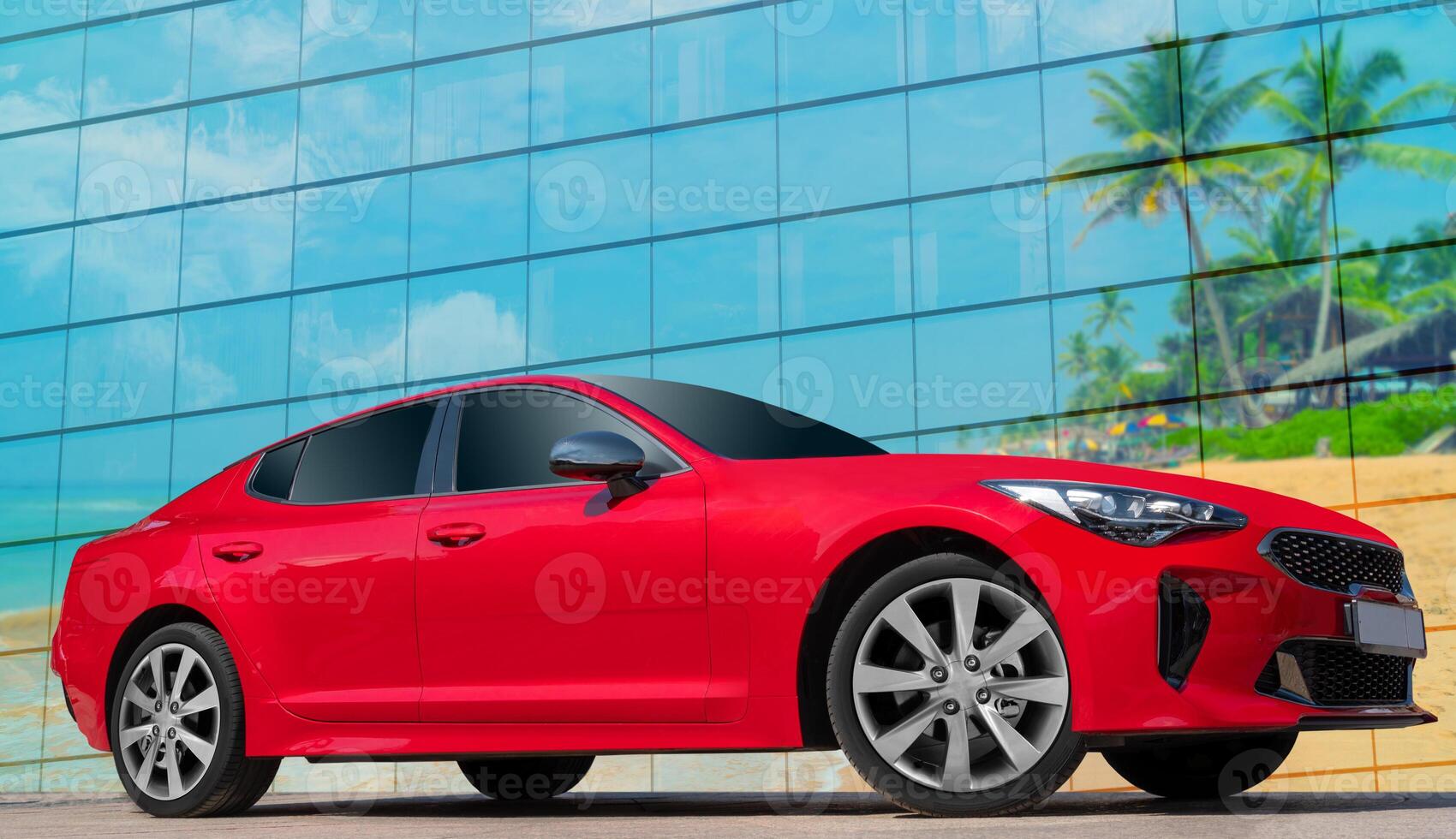 Red car on a background of palm trees. Stylish, modern, bright image of the car for design solutions. Profile view in the tropics. photo