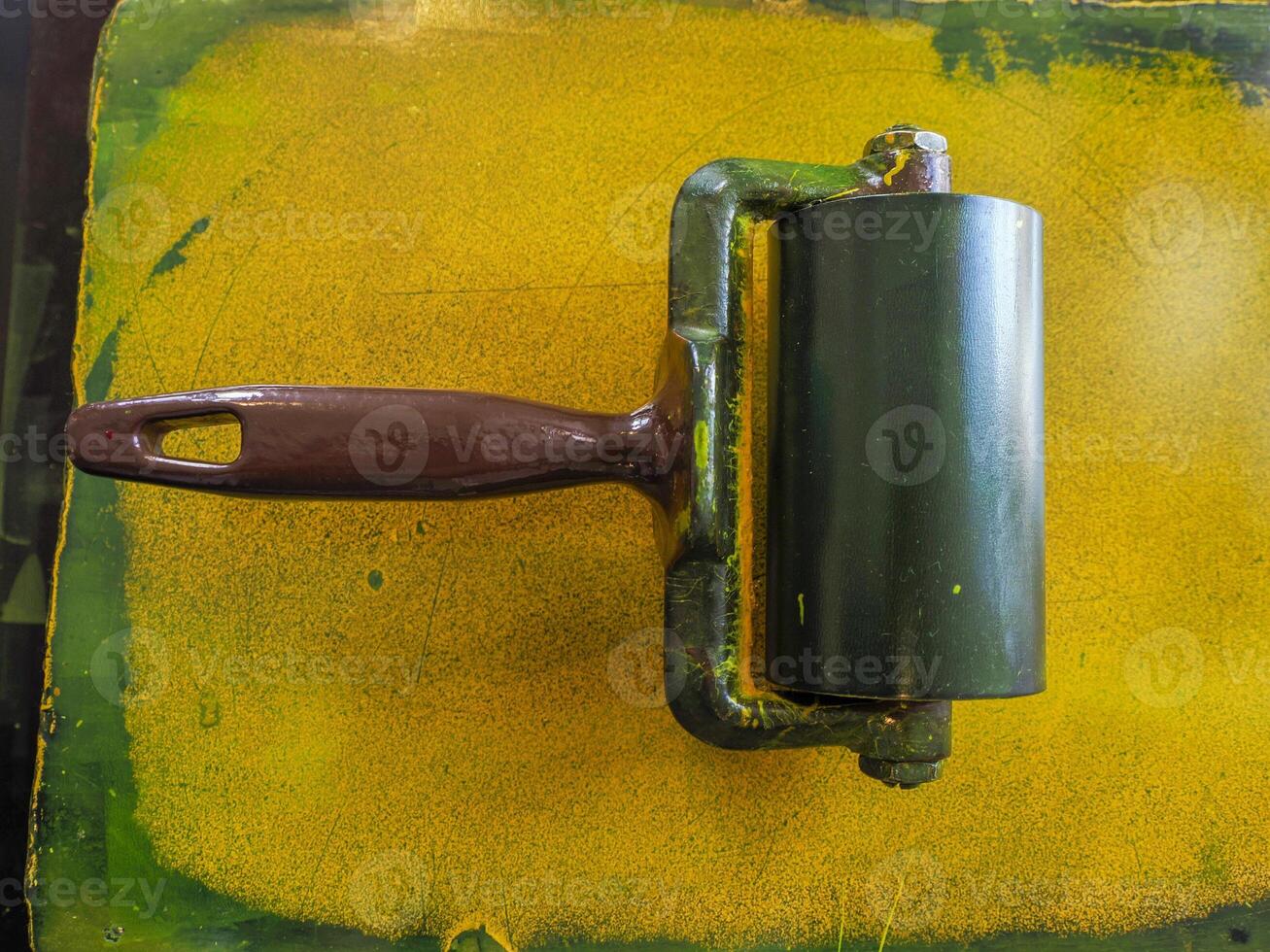 detail of yellow color swab old printing press machine photo