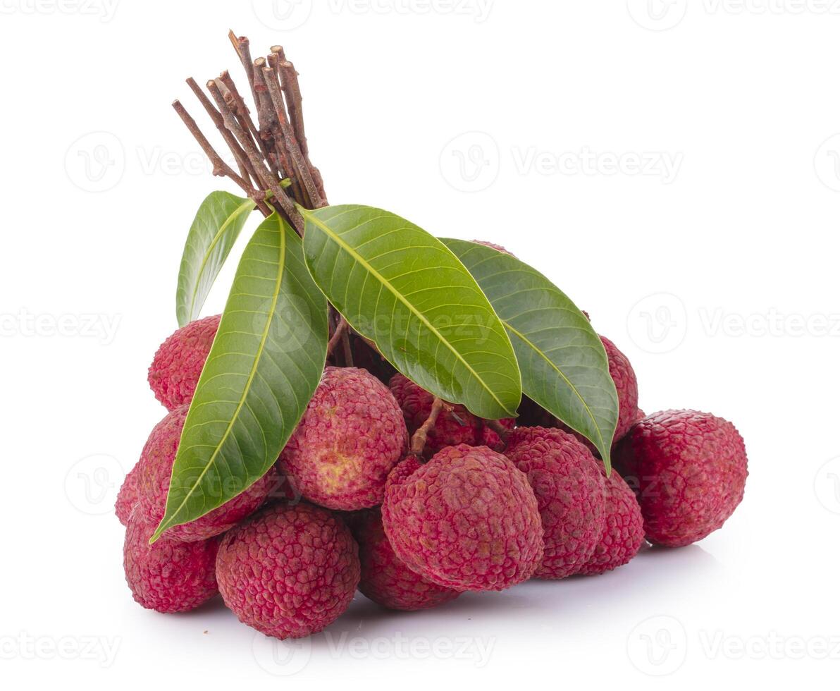 Fresh lychees and green leaves isolated on a white background photo