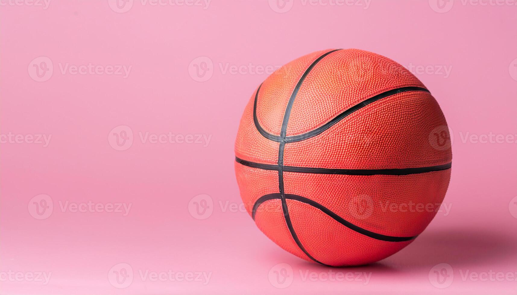 Basketball ball isolated on pastel pink background. Sport, competitive game. photo
