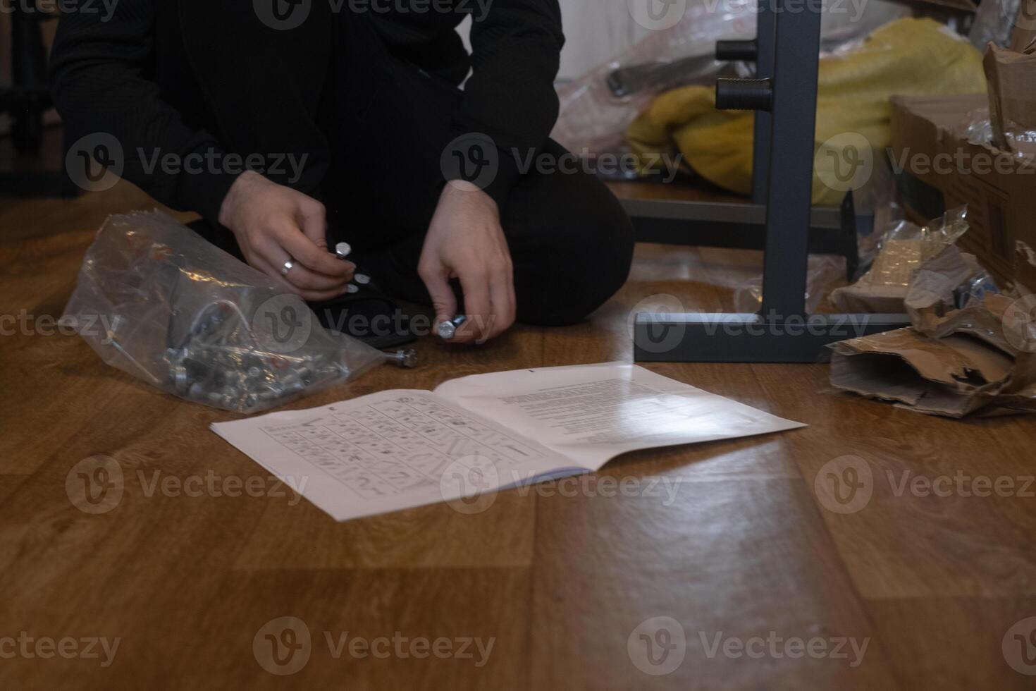 Man assembling home gym equipment creating a comfortable space for workouts and fitness at home. photo